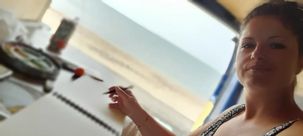 illustration sur commande à l'aquarelle, l'artiste S. Ferandez peint face à la mer